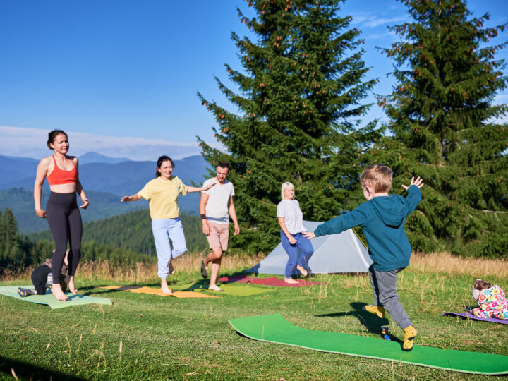 Group of people doing yoga pose outdoor in camping 2026 01 07 01 02 42 utc